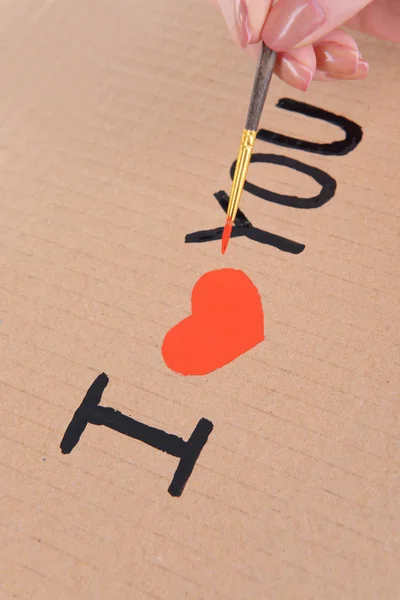 Herz mit Bleistift auf Papierbogen in Großaufnahme gezeichnet — Stockfoto