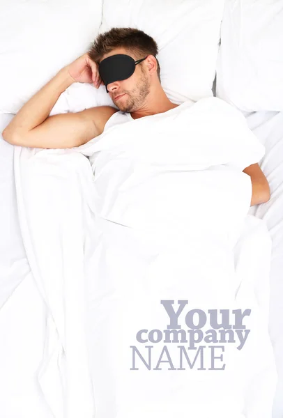 Handsome young man in bed — Stock Photo, Image
