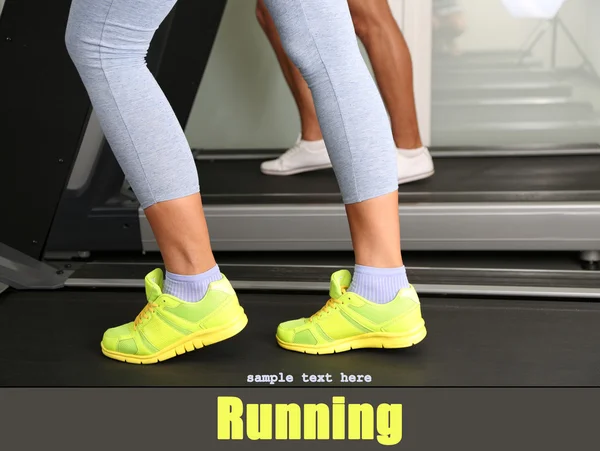 Women and men feet on treadmill close-up — Stock Photo, Image