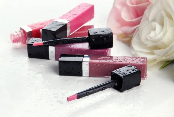 Beautiful lip glosses, isolated on white — Stock Photo, Image