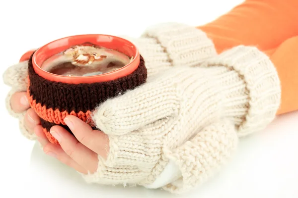 Cup with knitted thing on it in female hands isolated on white — Stock Photo, Image