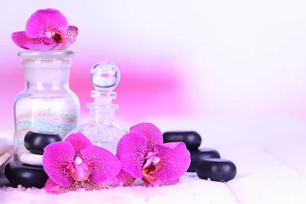 Beautiful spa setting with orchid on white wooden table on bright background — Stock Photo, Image