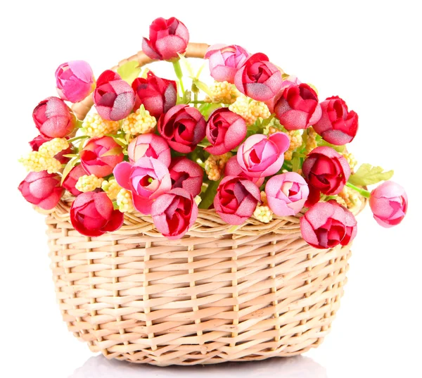 Bouquet of beautiful artificial flowers in wicker basket, isolated on white — Stock Photo, Image