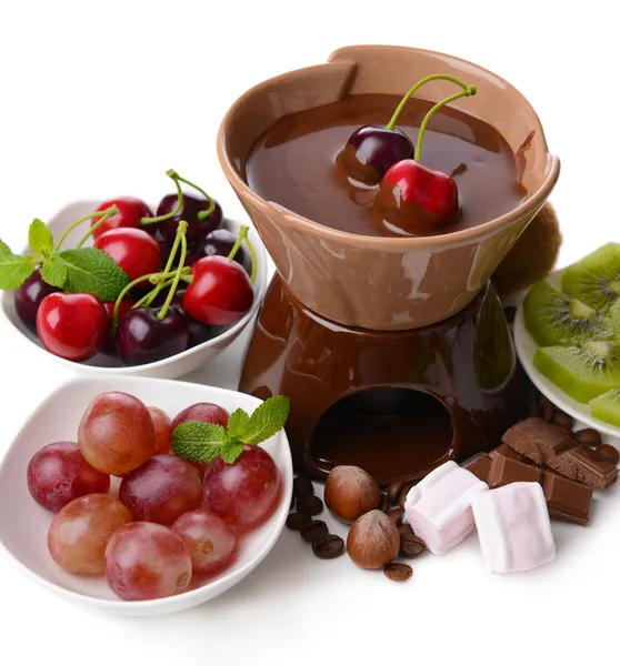 Chocolate fondue with marshmallow and fruits, isolated on white — Stock Photo, Image