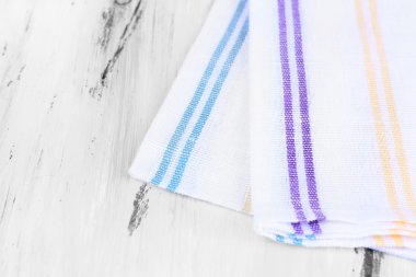 Kitchen towels on wooden background