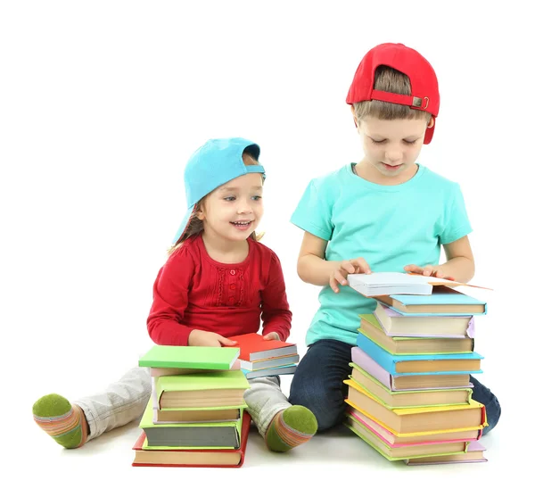 Niños pequeños con libros aislados en blanco —  Fotos de Stock