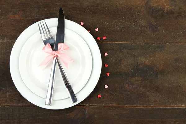 Romantic holiday table setting, on wooden background — Stock Photo, Image