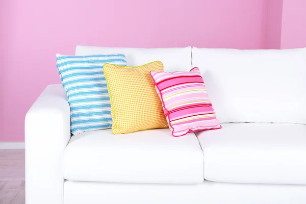 White sofa close-up in room on pink background — Stock Photo, Image