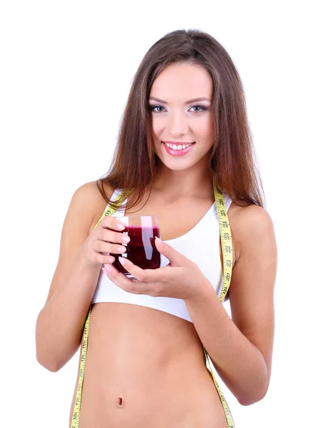 Beautiful girl with fresh juice and measuring tape isolated on white — Stock Photo, Image