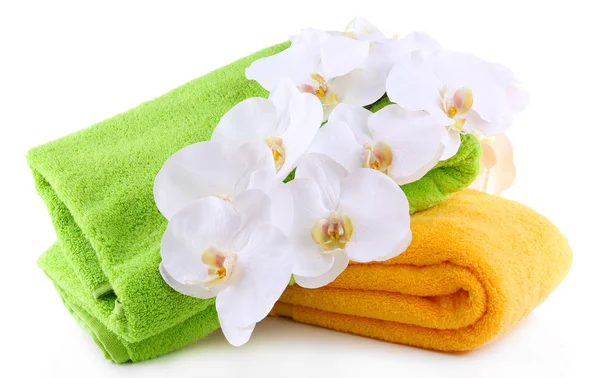 Colorful towels and flowers, isolated on white — Stock Photo, Image