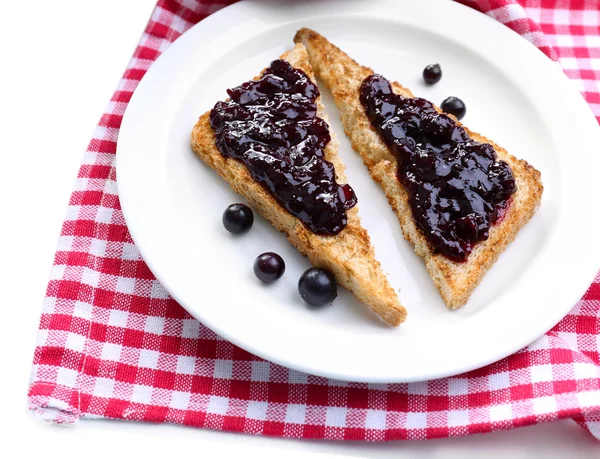 Delicious toast with jam on plate close-up — Stock Photo, Image