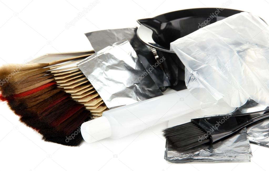 Hair dye kit and hair samples of different colors, isolated on white