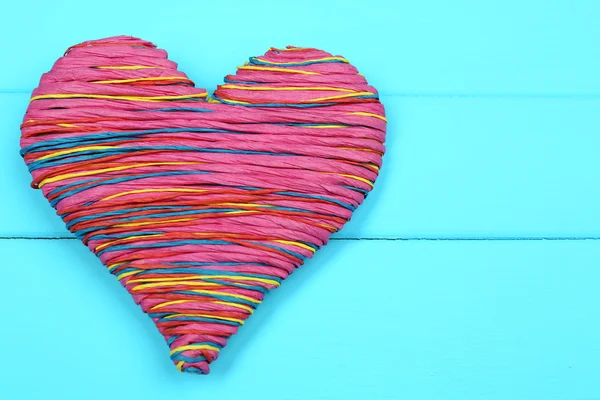 Decorative heart on wooden background — Stock Photo, Image