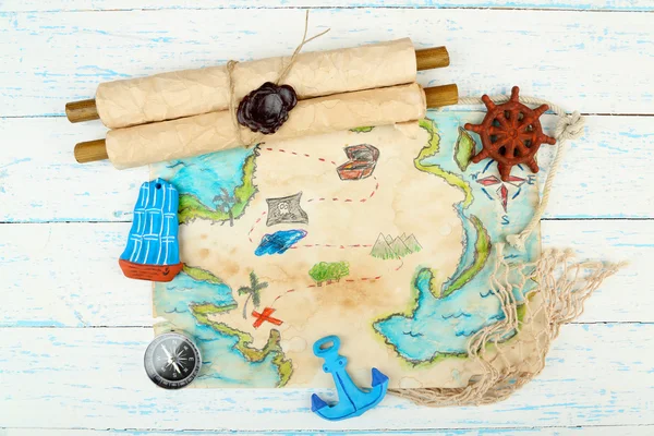 Treasure map with sea accessories, on wooden background — Stock Photo, Image