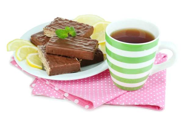 Cup of tea and sweets isolated on white — Stock Photo, Image