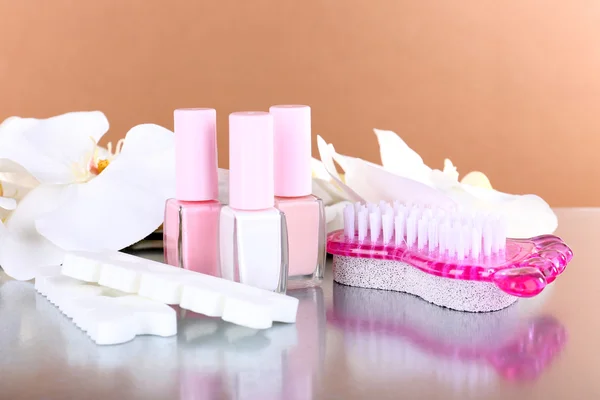 Pedicure set on table on beige background — Stock Photo, Image