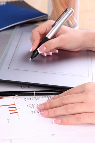 Female hand using graphics tablet on table close up — Stock Photo, Image