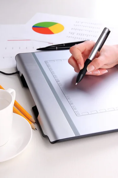 Female hand using graphics tablet on table close up — Stock Photo, Image