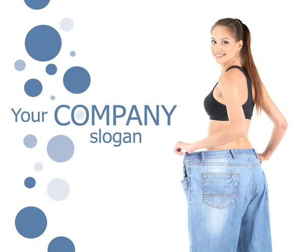 Slim girl in big jeans isolated on white — Stock Photo, Image