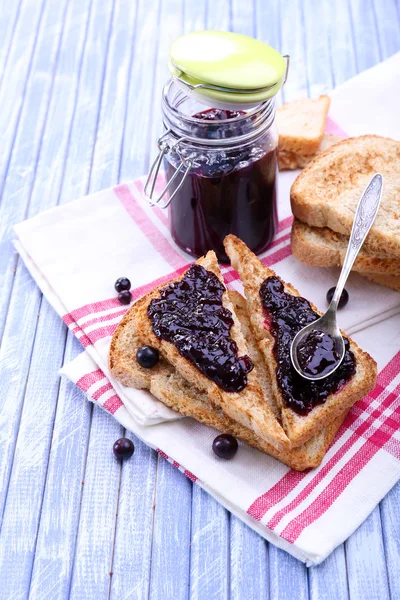 Delicious toast with jam on table close-up — Stock Photo, Image