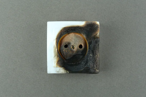 Burned plug socket close up — Stock Photo, Image