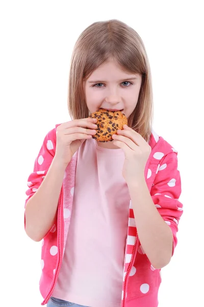 Menina bonita comer biscoitos isolados no branco — Fotografia de Stock