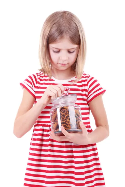 Beautiful little girl holding jar of cookies isolated on white — Stock Photo, Image