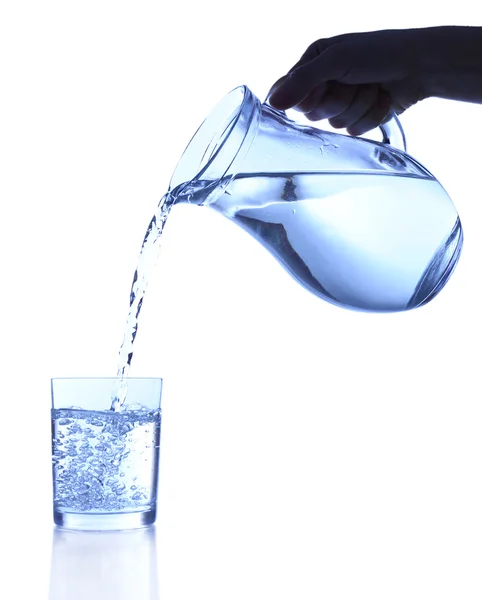 Pouring water into glass on blue background — Stock Photo, Image