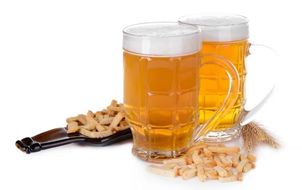 Glasses of beer with snack isolated on white — Stock Photo, Image