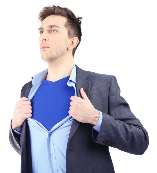 Young business man tearing apart his shirt revealing superhero suit, isolated on white — Stock Photo, Image