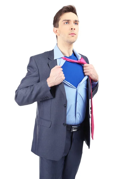 Joven hombre de negocios desgarrando su camisa revelando traje de superhéroe, aislado en blanco —  Fotos de Stock