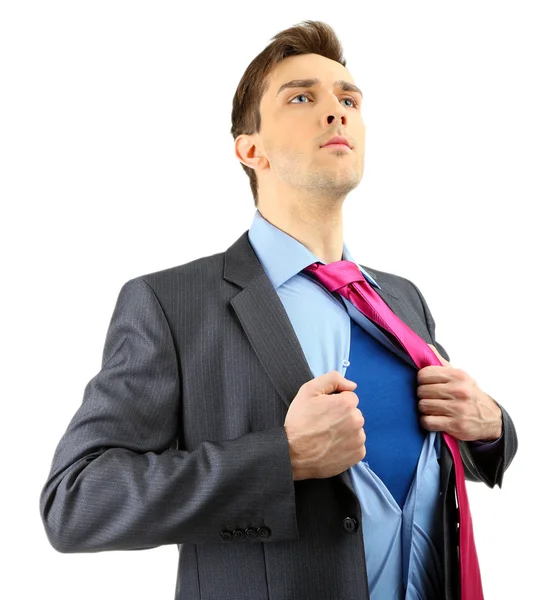 Young business man tearing apart his shirt revealing superhero suit, isolated on white — Stock Photo, Image