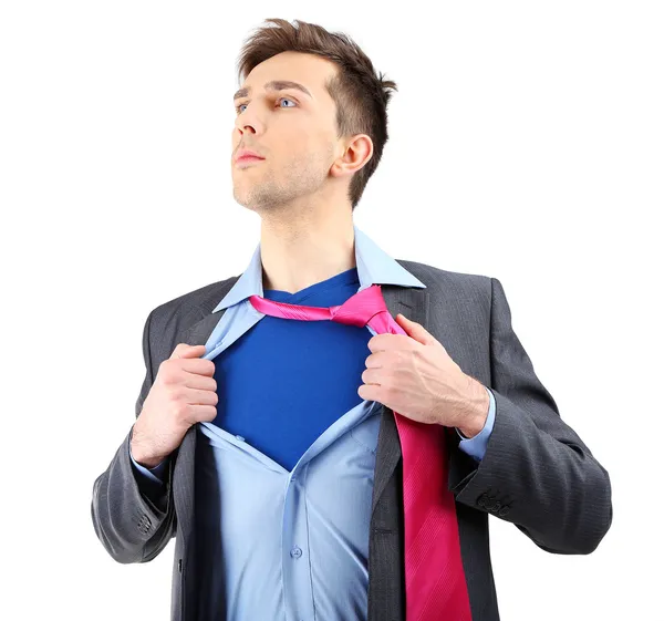 Jovem homem de negócios rasgando sua camisa revelando terno de super-herói, isolado em branco — Fotografia de Stock