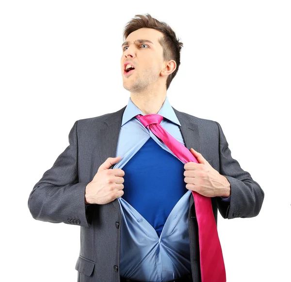 Young business man tearing apart his shirt revealing superhero suit, isolated on white — Stock Photo, Image