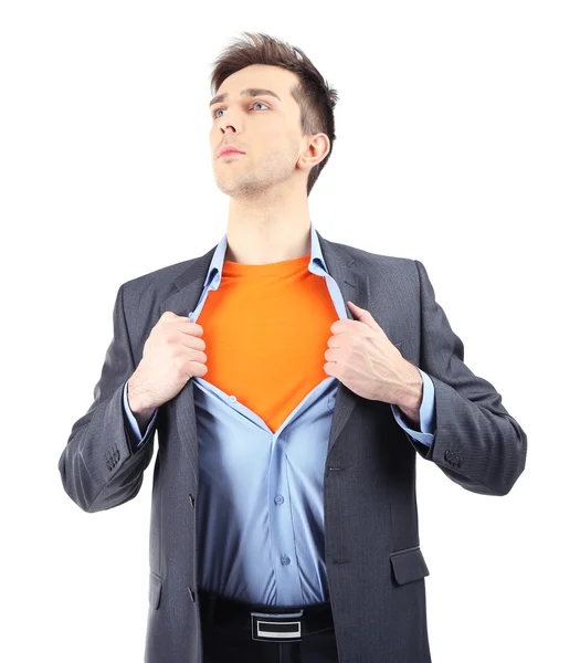 Junger Geschäftsmann auseinanderzureißen sein Hemd enthüllt Superhelden-Anzug, isoliert auf weiss — Stockfoto
