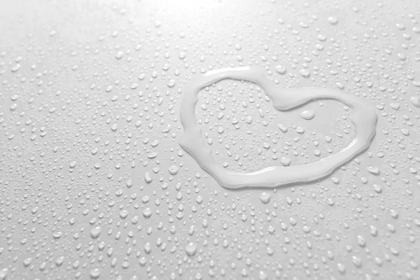 Water drops on light background — Stock Photo, Image