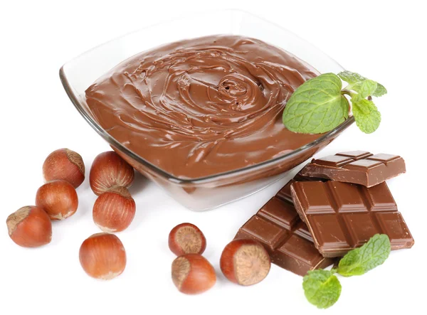 Sweet chocolate hazelnut spread with whole nuts and mint isolated on white — Stock Photo, Image