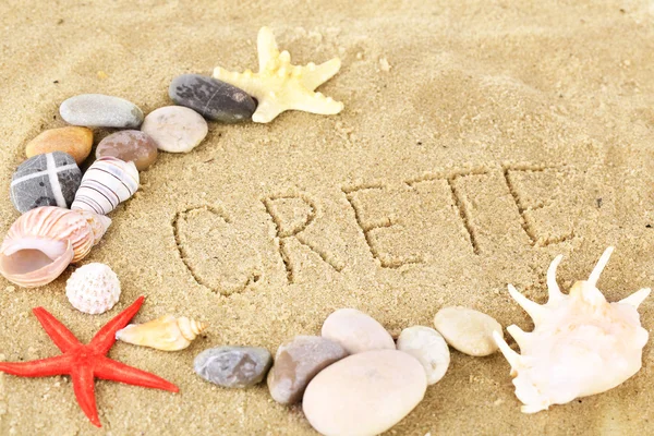 Inscription Crete in wet sand close-up background — Stock Photo, Image