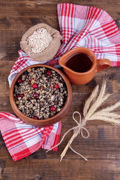 Plate with kutia - traditional Christmas sweet meal in Ukraine, Belarus and Poland, on wooden background — Stock Photo, Image