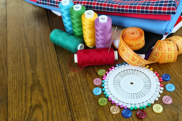 Sewing accessories on wooden table — Stock Photo, Image