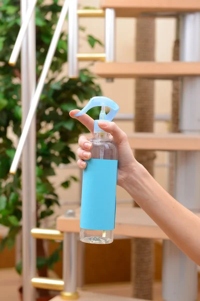 Sprayed air freshener in hand close-up — Stock Photo, Image