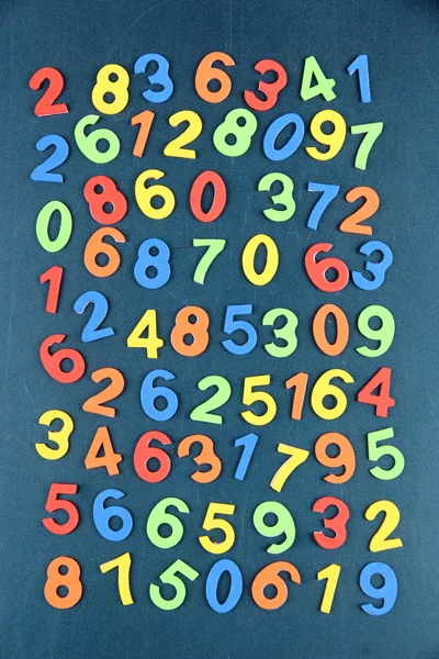 Colorful numbers on school desk background — Stock Photo, Image