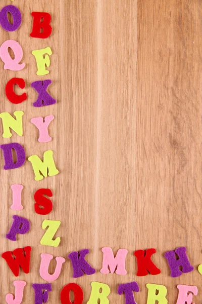 Engelse alfabet op houten achtergrond — Stockfoto