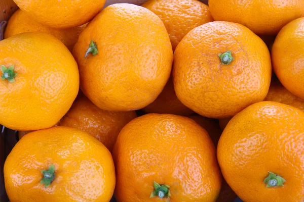 Rijpe zoete mandarijnen achtergrond — Stockfoto