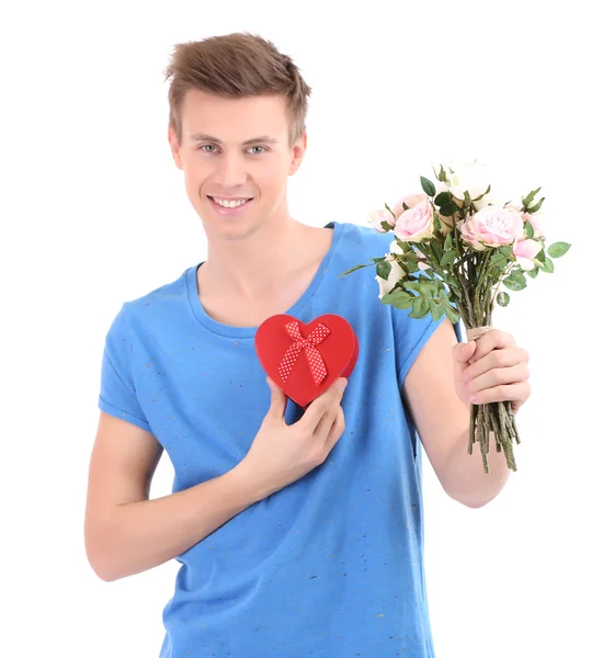 Portrait of handsome young man with flowers and gift, isolated on white — Stock Photo, Image