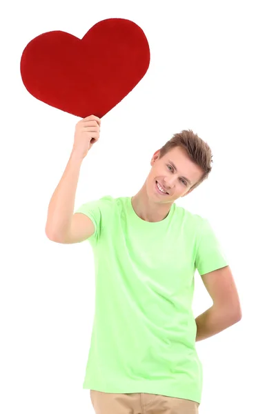 Knappe jonge man met grote rode hart, geïsoleerd op wit — Stockfoto