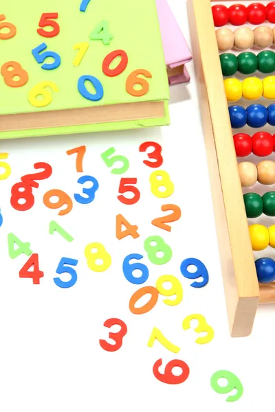 Colorful numbers, abacus, books and markers, isolated on white — Stock Photo, Image