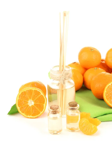 Tangerine essential oil and tangerines, isolated on white — Stock Photo, Image