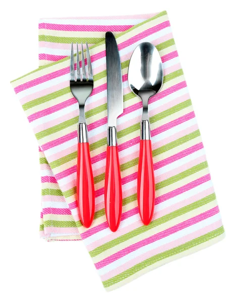 Kitchen cutlery on color napkin isolated on white — Stock Photo, Image