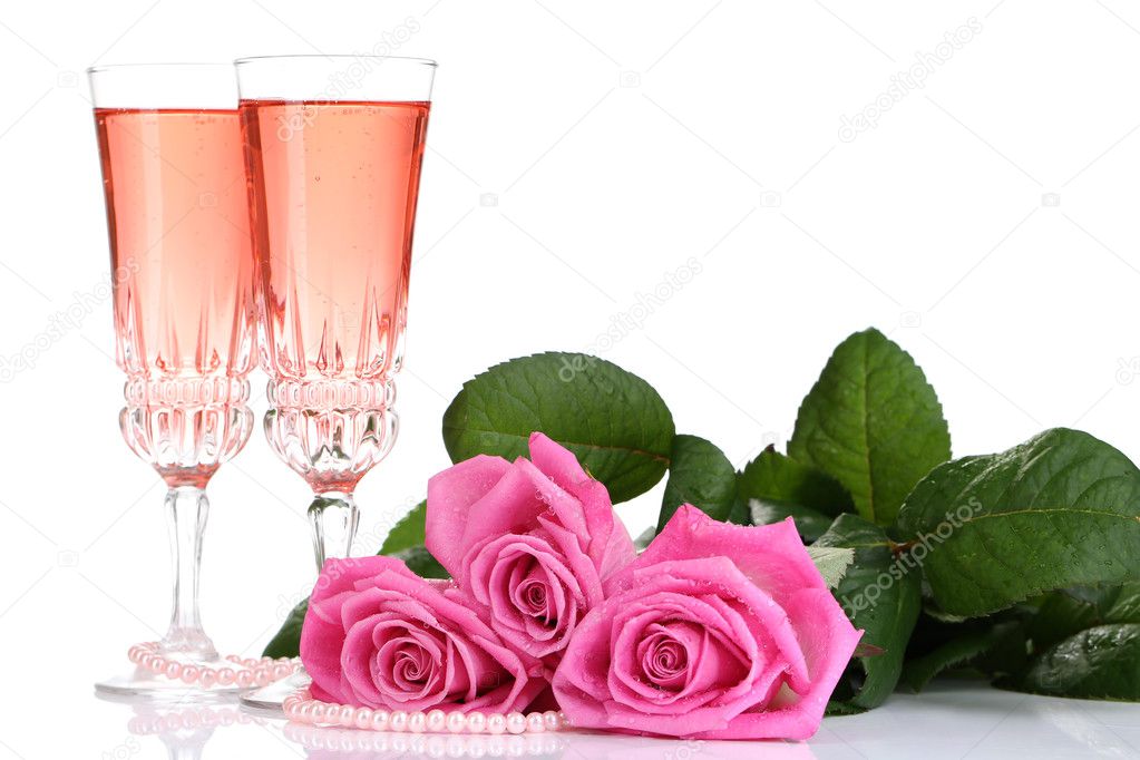 Composition with pink sparkle wine in glasses and pink roses isolated on white